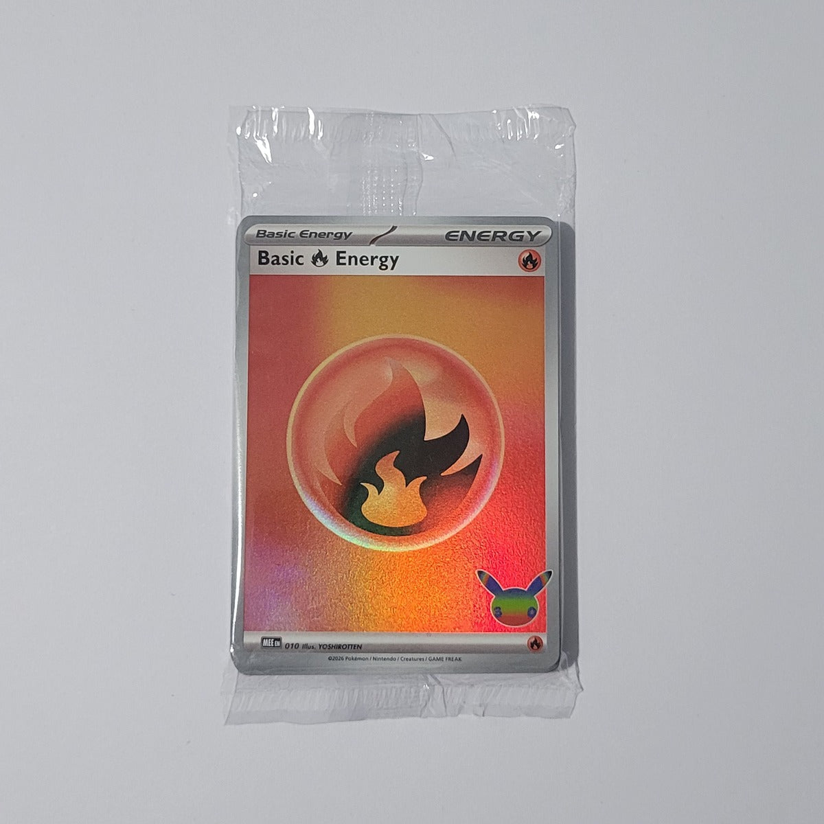 Sealed 30th Celebration ETB foil Energy pack with Basic Fire Energy visible – illustrative product photograph